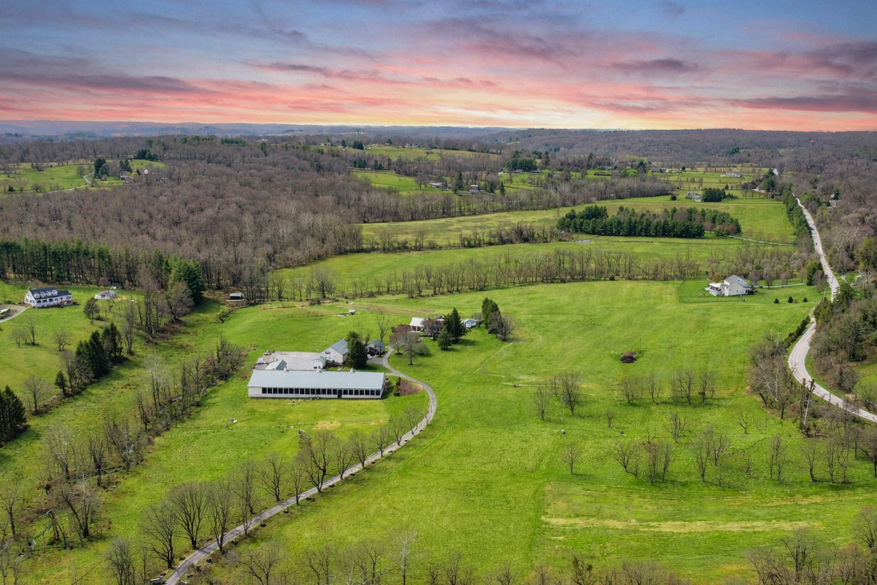 15314 PRICEVILLE ROAD, SPARKS GLENCOE, MD 21152 – Sweeping sunset aerial of rolling pastures and wooded hills across the Western Run Valley