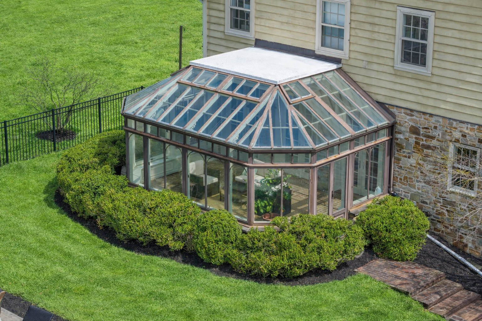 15314 PRICEVILLE ROAD, SPARKS GLENCOE, MD 21152 – Exterior of the glass conservatory addition framed by boxwood hedges and manicured lawn
