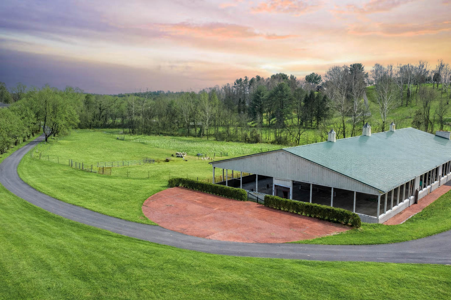 15314 PRICEVILLE ROAD, SPARKS GLENCOE, MD 21152 – Long green-roofed barn overlooking rolling pastures and distant hills at dusk